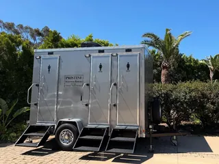 A restroom trailer set up at a private home